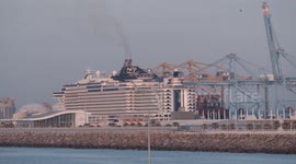 The large cruise ship MSC Seaview arriving into Barcelona port at sunrise