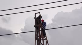 Two men do powerline repairs with NO safety equipment in Thailand
