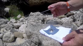 Making fire with paper and a Fresnel lens.