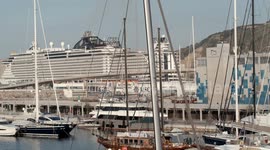 The large cruise ship MSC Seaview arriving into Barcelona port at sunrise