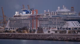 The large cruise ship Celebrity Edge in Barcelona port at sunrise
