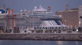The large cruise ship Celebrity Edge in Barcelona port at sunrise