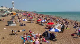 Heatwave on Brighton Beach, crowded and busy