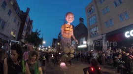 Giant Puppet Chases Balloons In Bow