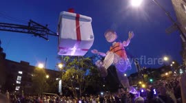 Giant puppet walks down road in East London