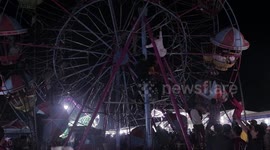 Terrifying scenes as Indonesian fairground goers become stranded on ferris wheel