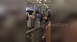 Fans of K-pop act NCT 127 grapple with airport security to enter first-class lounge