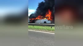 Black smoke pours out of coach that was carrying UK children