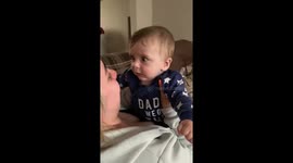 Baby gets hilariously spooked by raspberries blown on his cheek