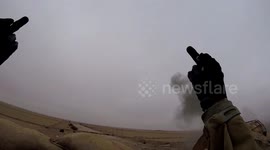 Kurdish fighter on Syrian frontline flips Islamic State the double bird after rocket hits nearby
