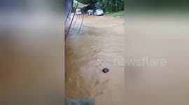 Students stranded inside classrooms as flash flooding hits the Philippines