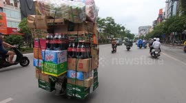 Overload on overloading! Ridiculously overloaded motorbike carrying a lot of cargo boxes piled high