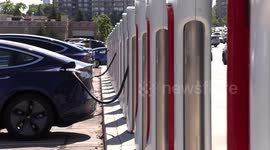 Busy Tesla electric car charging station in Markham Canada this weekend with only a few spots left to charge up the batteries on the electric vehicles as they gain popularity in an era of climate emergency