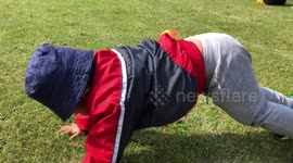 Toddler doing funny pushups