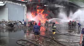Firefighters tackle huge blaze at palm oil warehouse in Indonesia