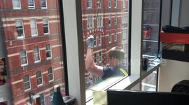 Window cleaner gets safety harness jammed 4 floors above the ground in London city centre