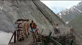 Indian officers form human shield to protect pilgrims from falling rocks