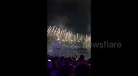 Massive crowd gazes at fireworks during Macy's 4th of July spectacular show