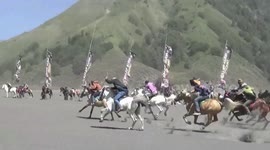 Hundreds of riders take to the sandy plains below Mount Bromo to race their horses