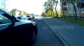 Car cutting of cyclist in the bike lane