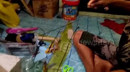 Artist Makes Ship-In-A-Bottle Ornaments From Junk