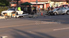 Toronto car crash sends cars onto sidewalk near busy Starbucks patio but luckily only one minor injury to one of the drivers in the two car collision on Yonge street