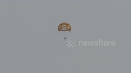 People parasailing by boat on Lake Ontario the hot sunny summer weather this morning nearToronto