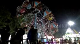 Indonesian fairground goers become stranded on ferris wheel damaged by broken axles - FULL VERSION