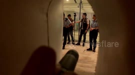 Hong Kong protestors shine flashlights and hurl abuse at police