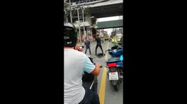 Shocking moment drivers fight in the middle of the road as girl pleads for them to stop