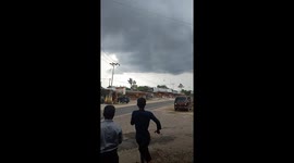 Debris from tornado hits power lines, panics onlookers in Indonesia