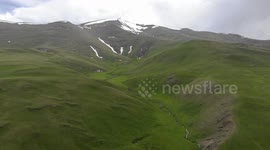 Drone video of Mountain  snow and river between,  South of Naryn, Kyrgyzstan.