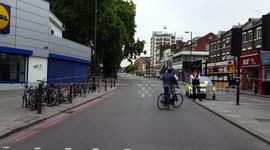 London police cordon off scene where one man was shot and another stabbed in Finsbury Park