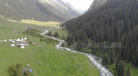Drone video of Altyn Arashan River, Yurts Village, Karakol, Issyk Kul Lake, Kyrgyzstan, Central Asia.