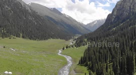 Drone video of Altyn Arashan River, Yurts Village, Karakol, Issyk Kul Lake, Kyrgyzstan, Central Asia.