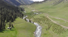 Drone video of Altyn Arashan River, Yurts Village, Karakol, Issyk Kul Lake, Kyrgyzstan, Central Asia.