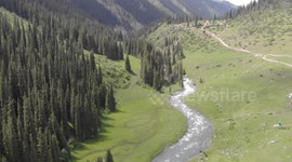 Drone video of Altyn Arashan River, Yurts Village, Karakol, Issyk Kul Lake, Kyrgyzstan, Central Asia.