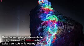 Climber turns his route into a rainbow as he scales sheer rocks while wearing LED lights
