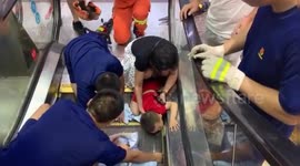 Firefighters free toddler after he got his arm stuck in escalator in Chinese mall