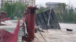 Wooden footbridge collapses during flash flooding in China's Shangrao