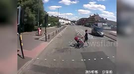 Impatient cyclist suffers instant karma when he runs a red light and crashes into two lampposts