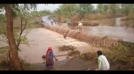 Intense moment as motorcyclist gets swept away by flooded road in India