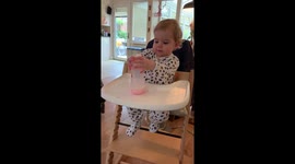 Baby does the bottle cap challenge