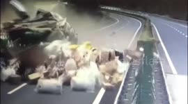 Loaded goods scatter across Chinese motorway after huge truck collision