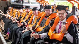 University students receive degrees in UK's wackiest graduation ceremony - on a ROLLERCOASTER