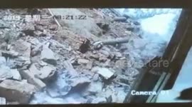 Woman narrowly avoids being buried by collapsing wall in China's Ganzhou