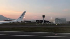 Ryanair flight taking off with backdrop of Naples and mount Vesuvius
