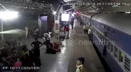 Commuters rush to save woman from being run over by train in western India