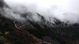 Time-lapse footage shows fog appearing to rise from Russian hillside