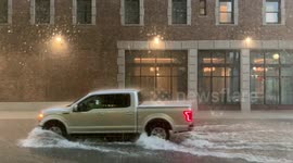 Cars power through flooded New Orleans road as Storm Barry hits